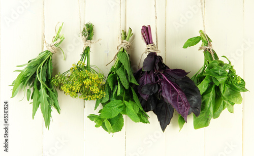 Fototapeta na wymiar Fresh herbs on wooden background