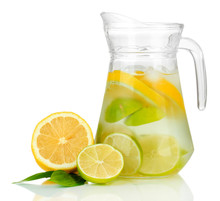Cold Water With Lime, Lemon And Ice In Pitcher Isolated On