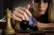 © grufnar - woman surrendering her king in chess