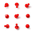 Set of red push pins with different angles isolated