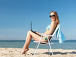 © Syda Productions - girl looking at tablet pc on the beach