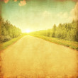 Rural road through the forestat sunset.Grunge and retro style.