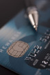 © rmonochrome - Blue Credit Card with a Pen