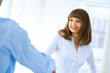 © adam121 - business woman shaking hands with a client