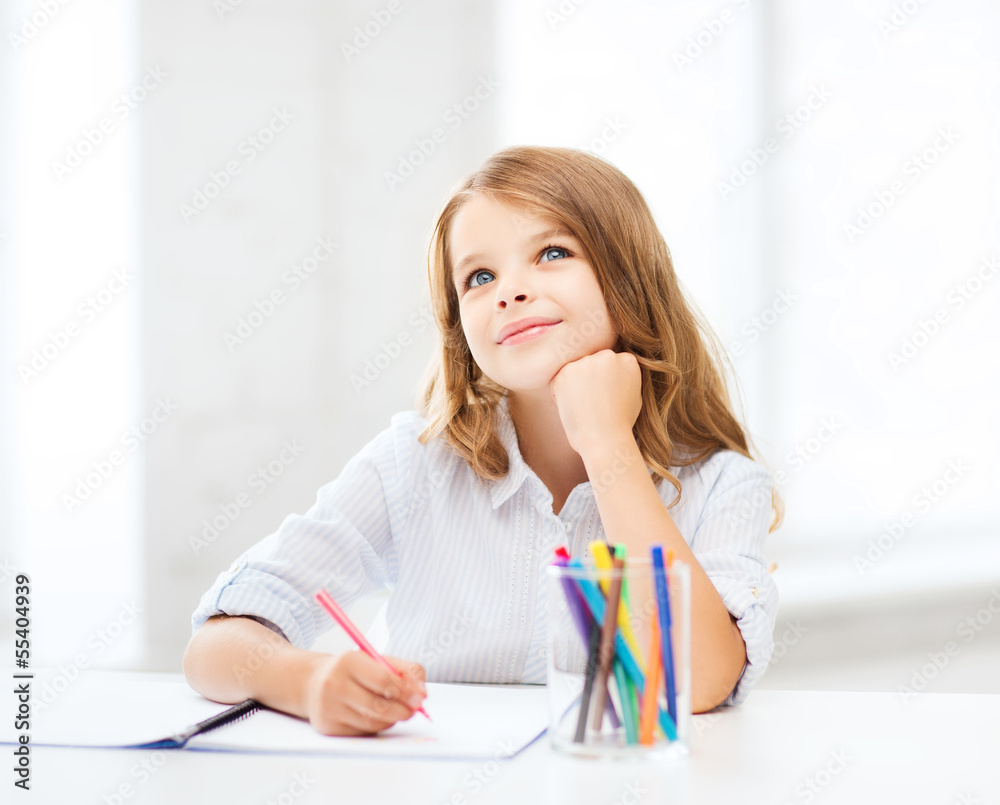 little student girl drawing at school Stock Photo | Adobe Stock