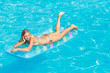© Netfalls - woman relaxing at the swimming pool