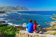 © Iuliia Sokolovska - Couple looking at ocean view, vacation in South Africa
