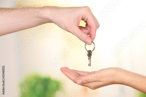 Fotografía Transfer of house key, on bright background