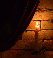 Burning Candle With Velvet Curtain