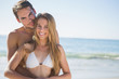 © WavebreakmediaMicro - Athletic couple smiling at camera and embracing