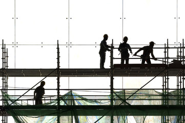 Construction worker silhouette at work