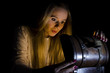 © grufnar - woman opening a small chest in the dark
