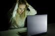 © grufnar - woman pulling her hair while working on laptop computer