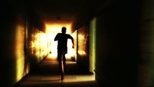 Silhouette Man Running Light In A Tunnel Escape Freedom Concept