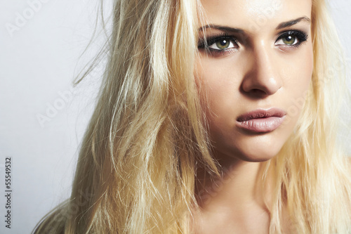 Fotografie, Obraz Beautiful blond woman with disheveled hair.make-up