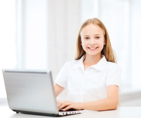 Canvas Print - girl with laptop pc at school