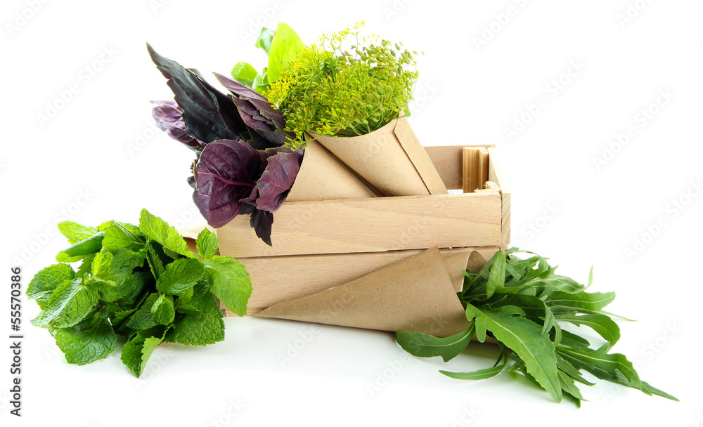 Fresh herbs in wooden crate, isolated on white