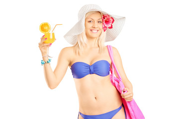 Poster - Attractive blond woman in bikini holding a cocktail