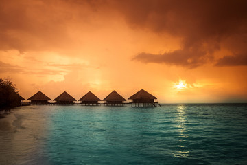 sunset on maldives island, water villas resort
