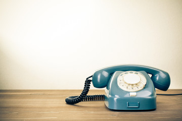 Fototapete - Retro background with rotary telephone on wood table