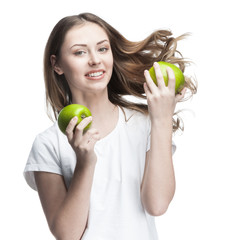 young woman with two green apples