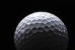 © shefkate - A close-up of a golf ball over dark background