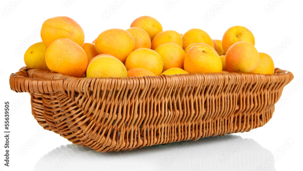 Fresh natural apricot in wicker basket isolated on white