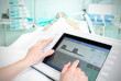 Touchpad in the hospital. The doctor adjusts the parameters of t