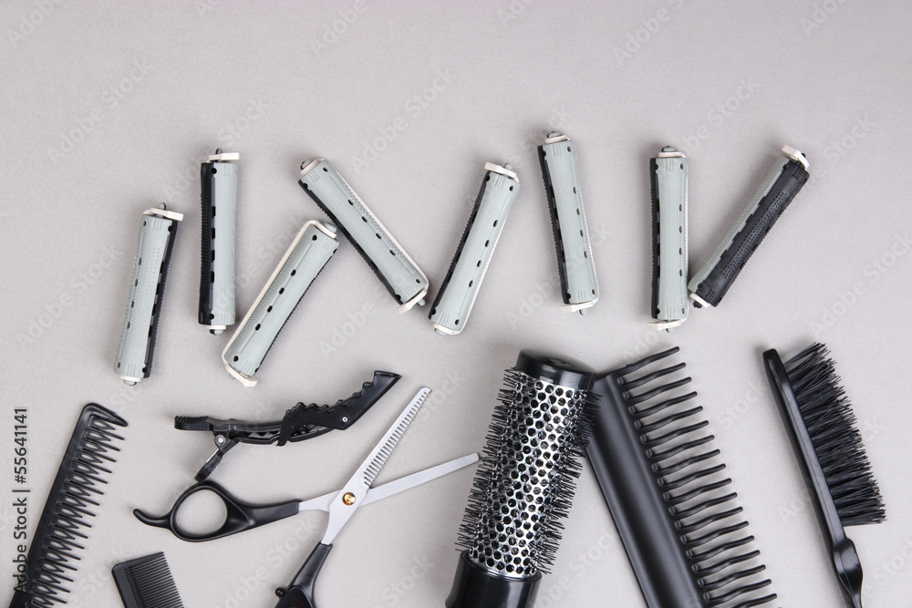 Professional hairdresser tools on gray background