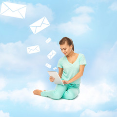 Canvas Print - woman sitting on the cloud with tablet pc