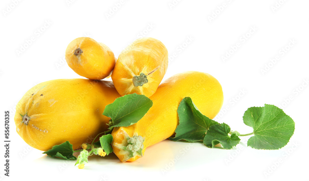 Raw yellow zucchini with leaves, isolated on white