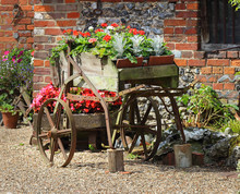 Flower Display In A Rustic Cart