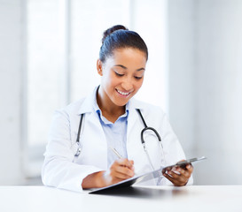 Poster - female doctor writing prescription