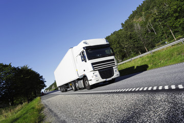 Poster - clean white truck driving on freeway.