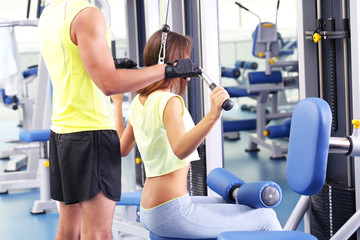 Wall Mural - Girl and trainer in gym