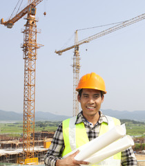 Wall Mural - Portrait of construction worker at construction site