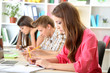© Africa Studio - Group of young students sitting at the library