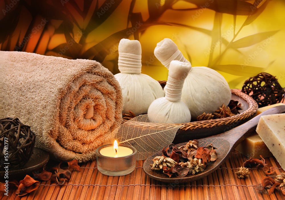 Massage background with rolled towel, spa balls and candlelight - obrazy, fototapety, plakaty 