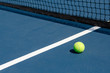 Tennis Ball on Court with Net