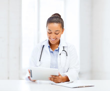 African Female Doctor With Tablet Pc