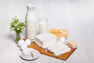Fototapete - milk and food on wooden background