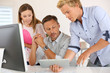 © goodluz - Business people in office working on desktop