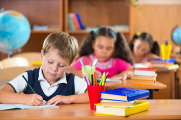 Schoolchildren in classroom at school