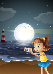 Wall Mural - A girl taking photos at the beach