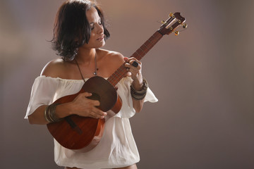 Cute four string guitar performer