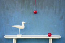 Still-life With Two Apple And White Bird Sculpture On Shelf