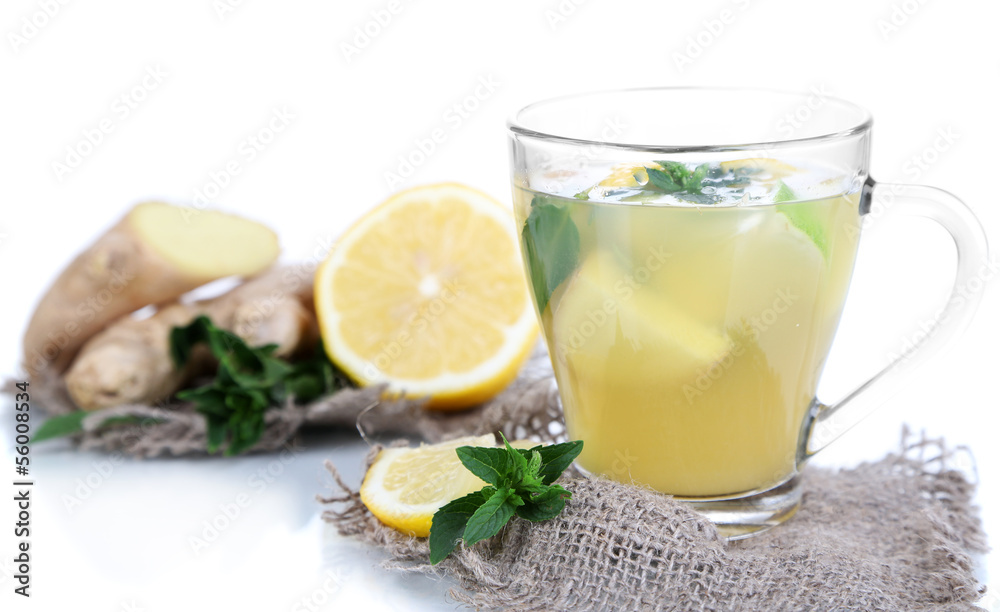 Cup of tea with ginger on sackcloth isolated on white