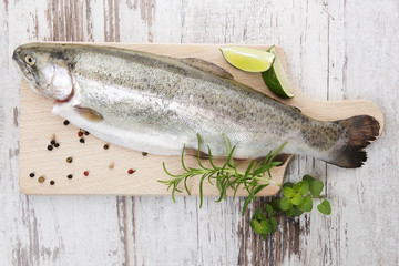 Sticker - Trout on wooden kitchen board.