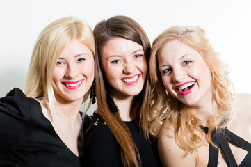 Three beautiful women friends closeup face portrait