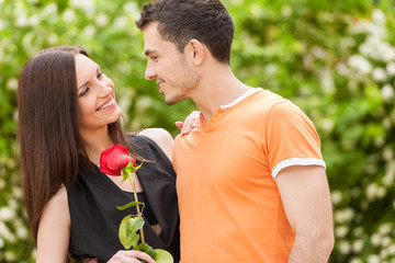 Wall Mural - Loving couple. Beautiful young loving couple hugging and looking